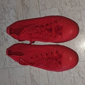 All red unisex Converse shoes. Low top. Women's size 7.5. Men's size 5.5.